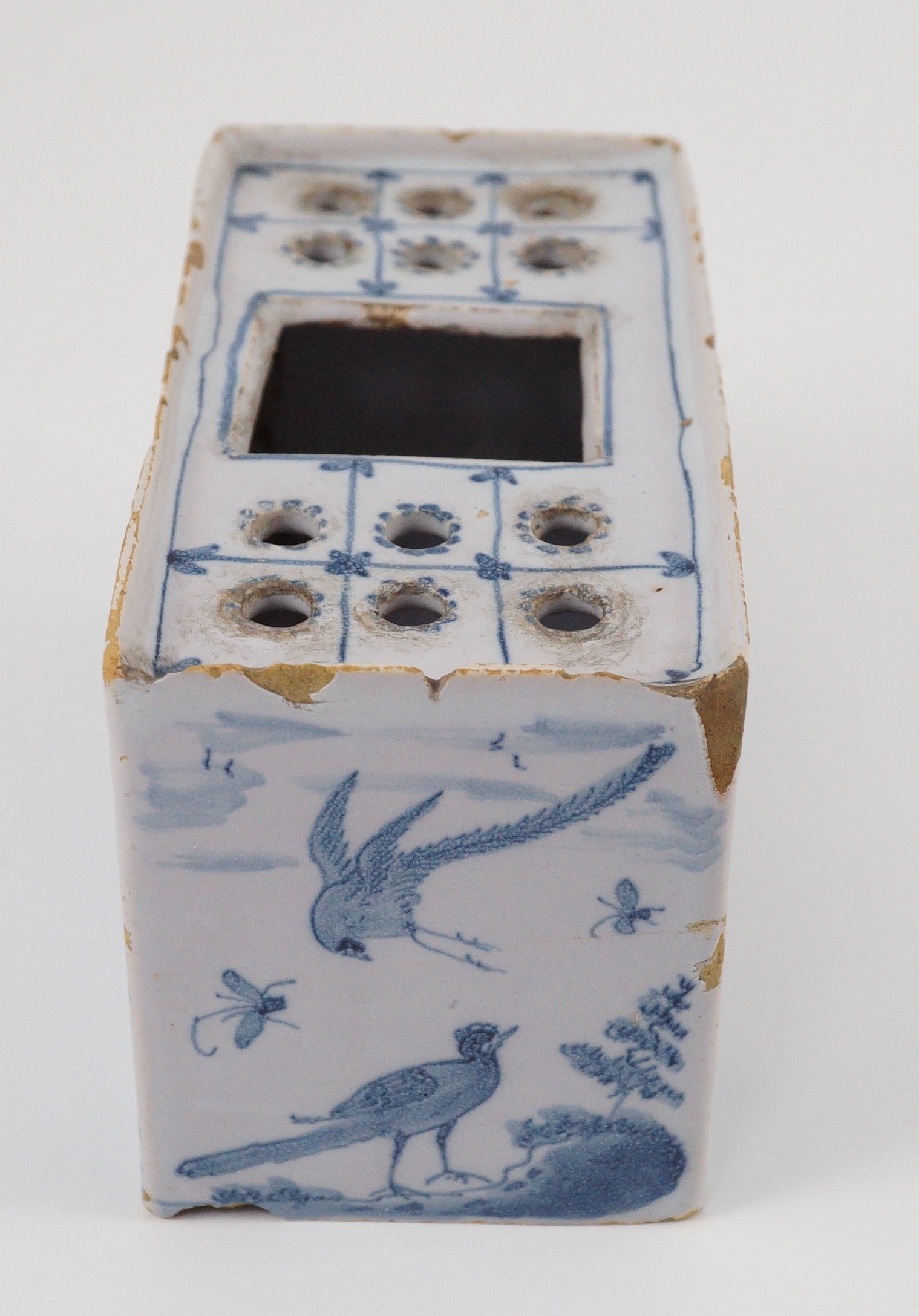 An English delftware flower brick, mid 18th century, 14.5cm wide, chips and crack